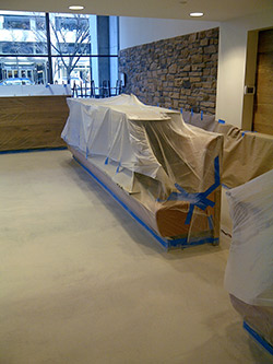 Plastic and paper are cheaper than having to come back to repaint or clean.
