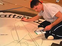 <IAC - stenciling logo into concrete floor>