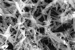 <microscopic image of yellow iron oxide pigments>