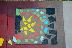 multicolored concrete mosaic on dual colored floor