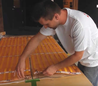 Floor heating pads are manufactured in straight runs and have thick connection wires to properly buss the system.