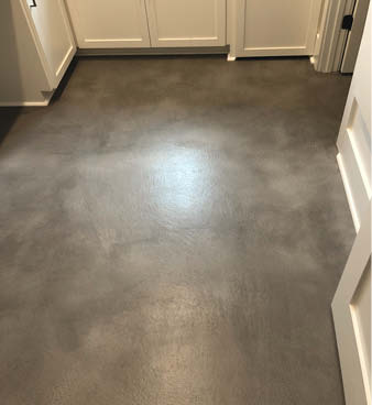 Colored concrete overlay in grays with a hint of red.
