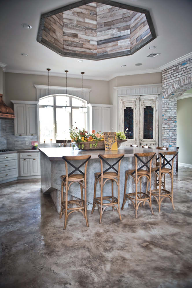 A completely remodeled concrete kitchen in whites, tans and grays.