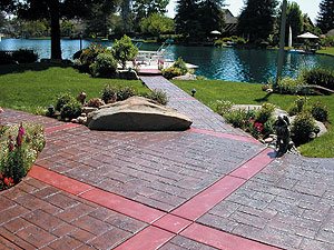 stamped walkway - Accent bands allow ashlar slate pattern to redirect. Some deep scoring is hidden in bands.
