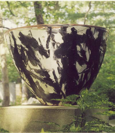 Black and white painted concrete pot