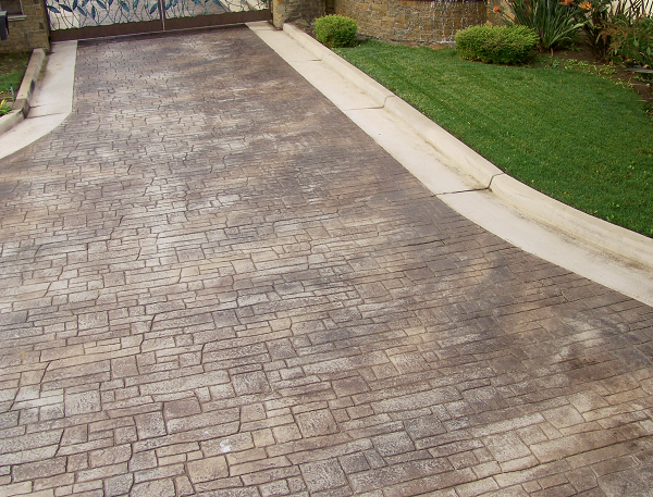Stamped concrete driveway colored with dust-on color hardener