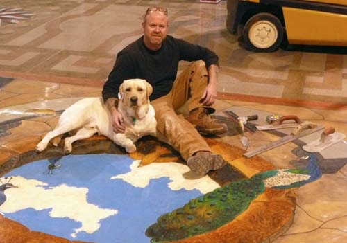Bob Harris and his dog Zeke on a finished concrete floor.