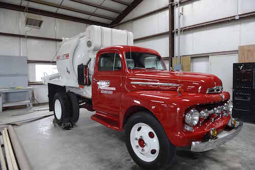A red tanker truck that is up for auction
