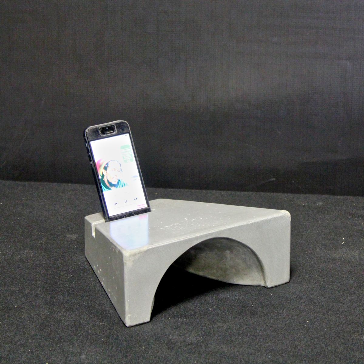 FIRST PLACE Amplif-i Concrete iPhone Dock Jonathan Haywood of Epic Artisan Concrete St Petersburg, Florida The Amplif-i Concrete iPhone dock uses natural acoustic amplification for all generations of iPhone.