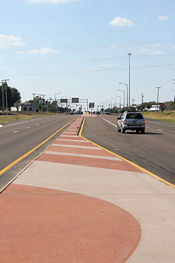 Two toned read and beige color hardener used on median of road.