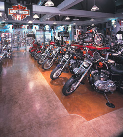 L. M. Scofield Co.s Chemstain Classic in Faded Terracotta and Black was applied to a white overlay to create vivid light-colored flooring at this Harley Davidson showroom in Glendale, Calif. Photo courtesy of L. M. Scofield Co.