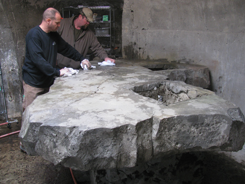 Nathan Giffin and an attendee work to create a concrete countertop.
