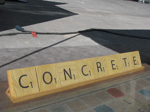 A look at the word concrete made with concrete to look like Scrabble pieces.
