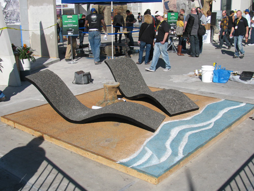 A stamped and stained pervious concrete beach and exposed-aggregate pervious chairs.
