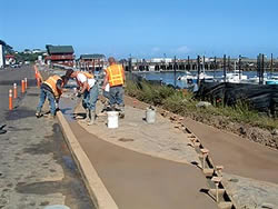 Bandon Boardwalk Construction - The North Bend, Ore., artisan consulted with the walkways planning architect before it even went to bid. A lot of architects up here on the Oregon Coast dont understand a lot about decorative concrete, he says. When the Port of Bandon finally put the Meandering Walkway project out for bid, Brock Construction won the contract.
