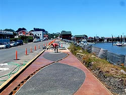 Bandon Boardwalk Construction - The concrete mix included a fiberglass mesh additive to improve its strength and allow workers to pull away texture mats without damaging the curing slab.