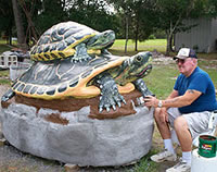 Two turtles made of concrete sculpture.