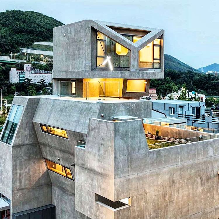 exposed concrete owl house by moon hoon