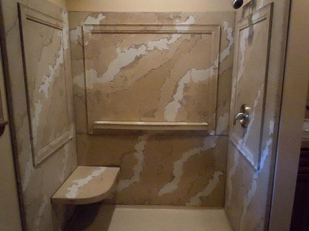 Shower created with a marblized pattern in concrete.