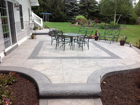Stamped concrete patio with borders in darker stain.