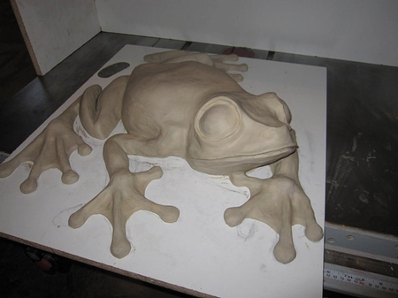 3-d frog design using concrete as the canvas.