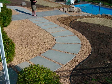 rounded concrete walkway made of individual small concrete pads.