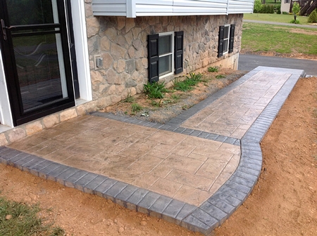 Concrete patio with a stamped and stained border.