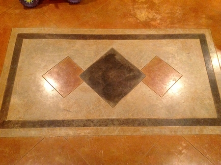 A decorative element stained onto the concrete floor.