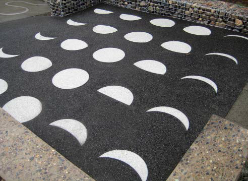 The phases of a moon are created for dramatic visual affect using a terrazzo application.