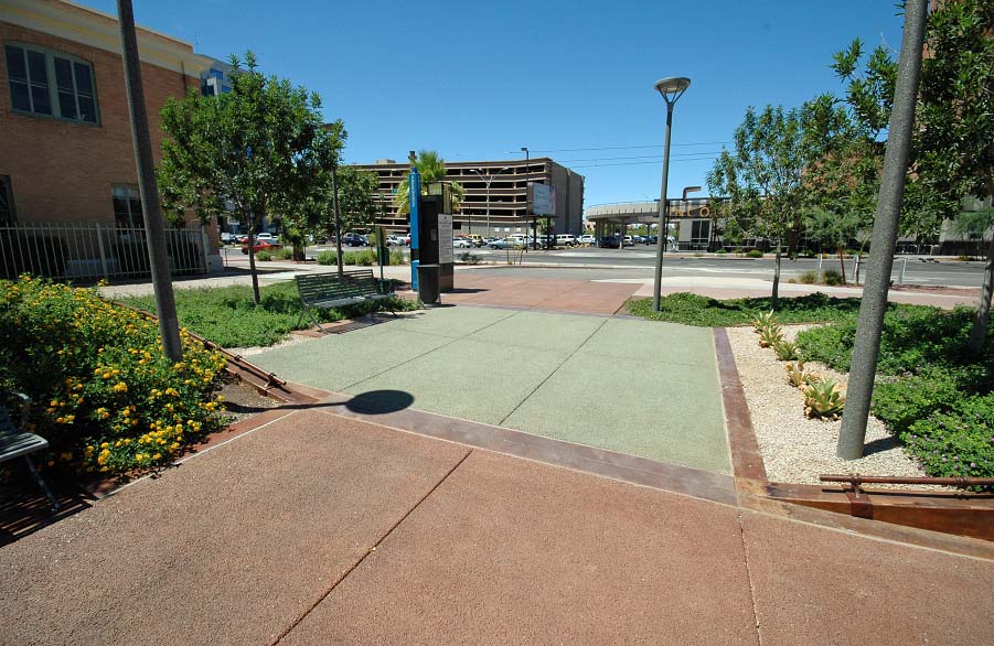 This plaza area in Phoenix features pervious concrete thats been colored terra cotta and green with spray-applied lithium-based stain from Bomanite. Photo courtesy of Progressive Concrete Works