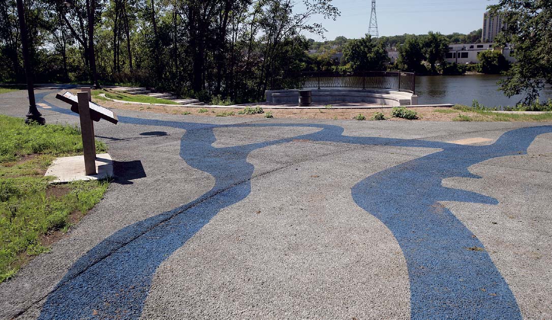 Edgewater Park in Minneapolis is designed to be sustainable, with prairie grass and native plants chosen for their low maintenance and their ability to capture storm-water. The pervious concrete fits right in. Its stained blue in places to mimic the paths of the nearby Mississippi and Minnesota rivers.