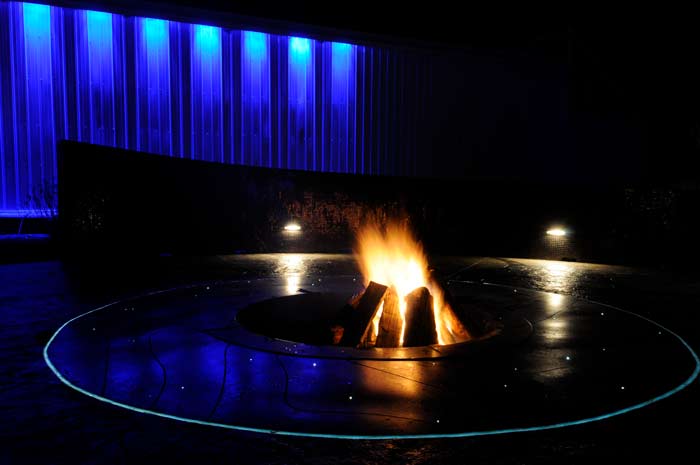 The fire pit and its fiber optic lighting, switched on at night.