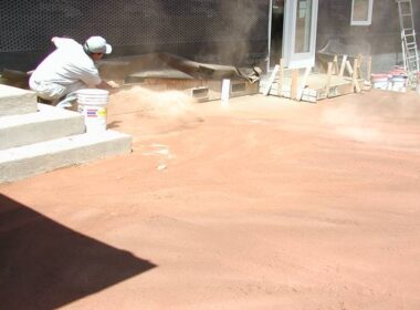 Throwing Color Hardener onto concrete for a non gray looking concrete slab.