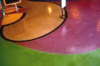 Solid magenta and green colors come alive with concrete stains on classroom floors