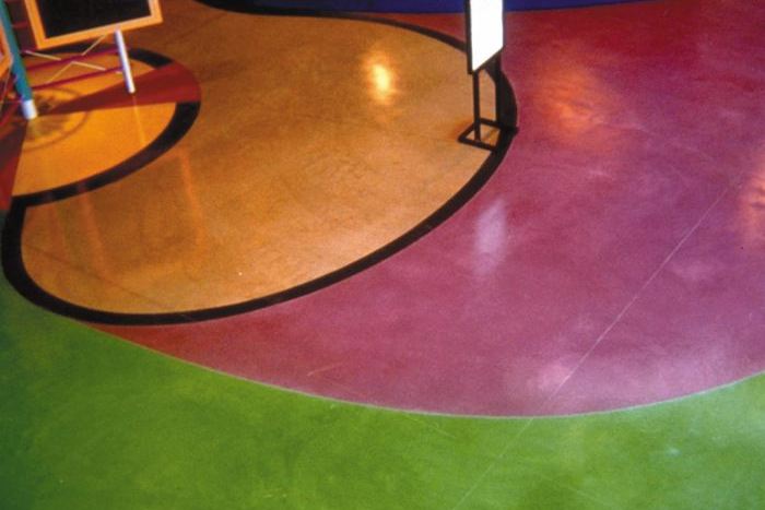 Solid magenta and green colors come alive with concrete stains on classroom floors