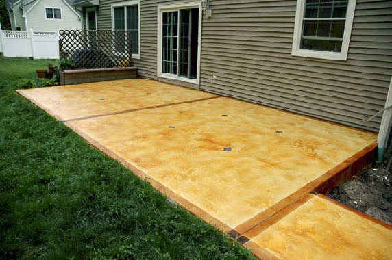 Outdoor patio that has been stained and sealed by Custom Concrete Solutions.