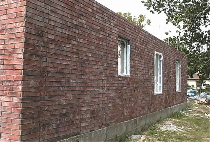 The wall has been made to look like a brick application however this look was achieved with the use of formliner and color.