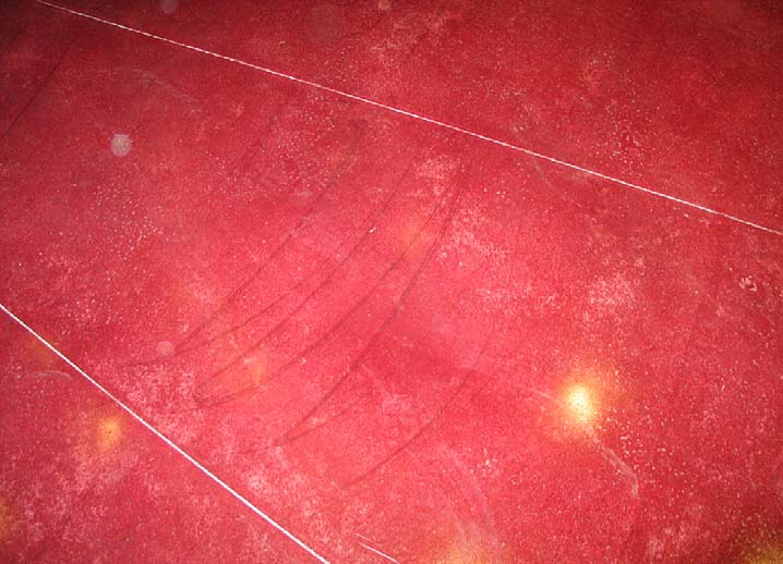 Failing to maintain a wet edge resulted in clearly visible roller marks on this dyed concrete floor. Photo courtesy of Chris Sullivan