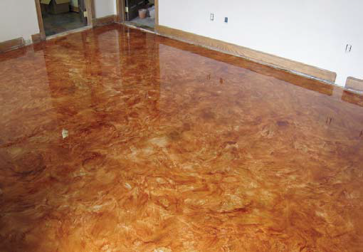 Metallic epoxy coated floor in rich amber and gold.