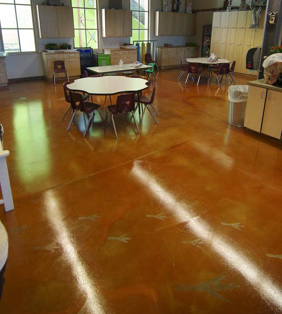 The team got to work the Monday following the Show. They abraded the entire floor, patching holes with Meadow- Patch T2. They applied Rezi-Weld LV, a W.R. Meadows epoxy bonding agent, for primer, then hand-scattered 16-grit coarse sand from Borders Construction Specialties in Phoenix for bonding.