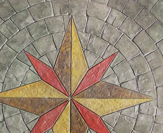 A radial stamp has been placed around a compass rose design in red and yellow.