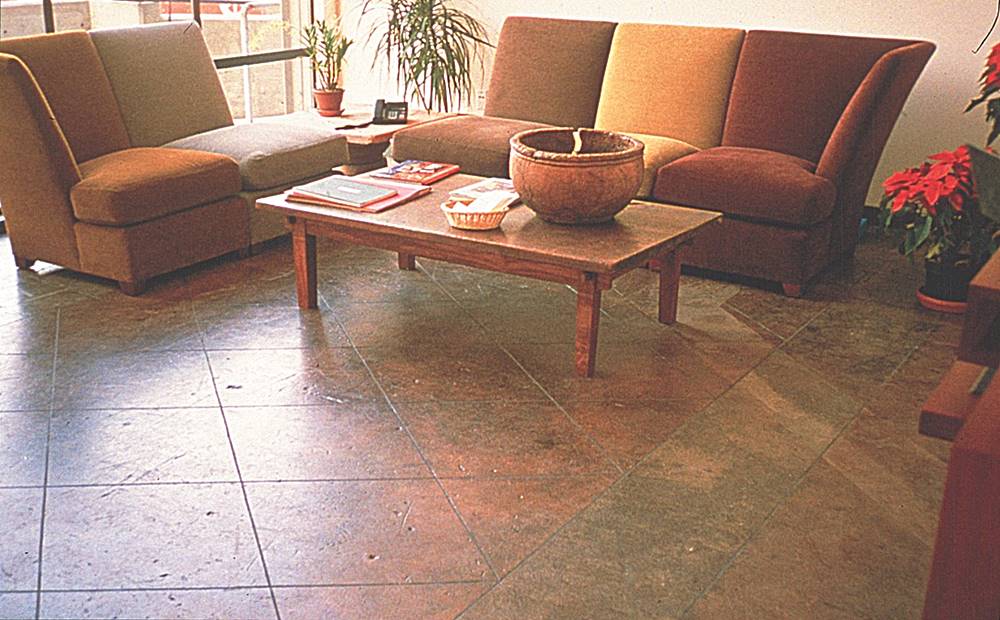 A water based stained concrete sun room floor. Unique finishes are obtained by using multiple colors of concrete stain.