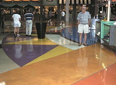Mesmerizing water based stained concrete floor with geometric styling in a shopping center food court.