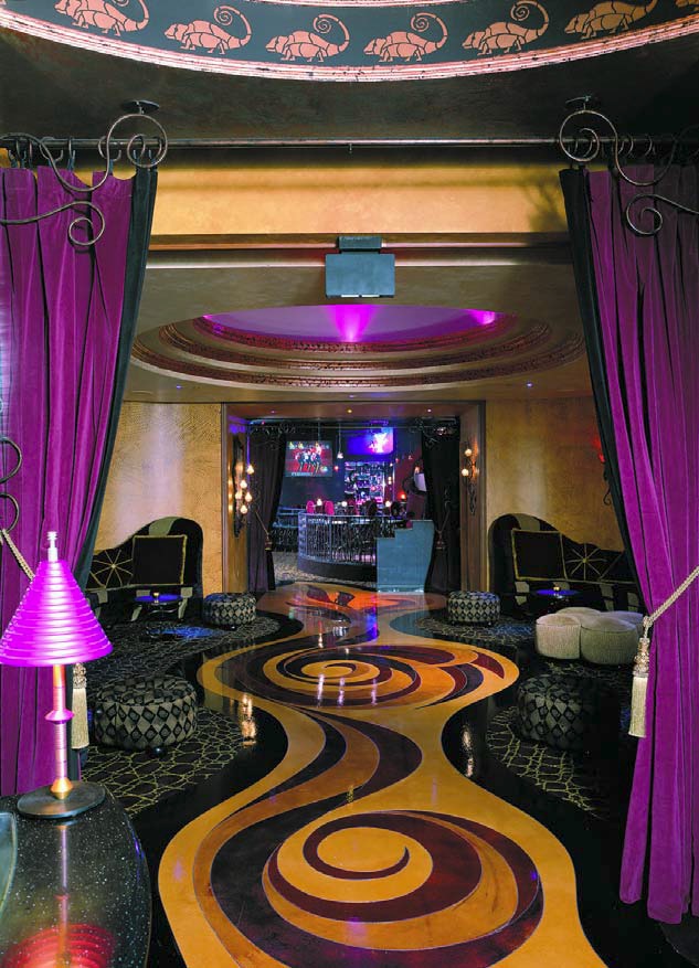 Swanky lounge accented with purples gives life to engraved and colored concrete.