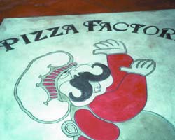 Engraving concrete is a good way to brand as this Pizza Factory logo was placed on a floor at a local pizzeria.
