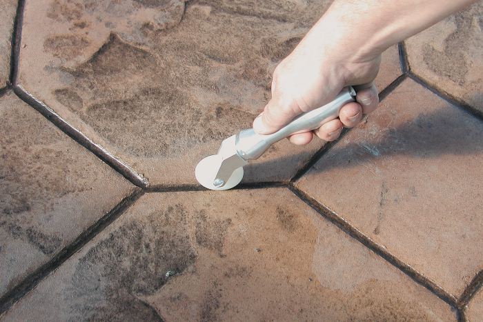 Roller Tools as seen here enhance the grout lines of stamped concrete