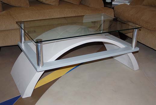 Concrete coffee table half circle leg design glass top and chrome legs.