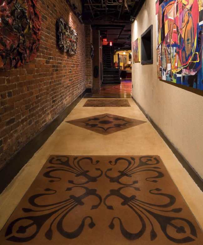 Wide hallway with Elite Crete overlay product stained into whimsical designs.