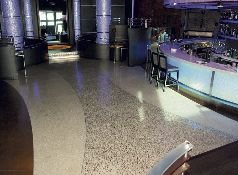 A terrazzo floor in this night club gives it a clean and edgy look.