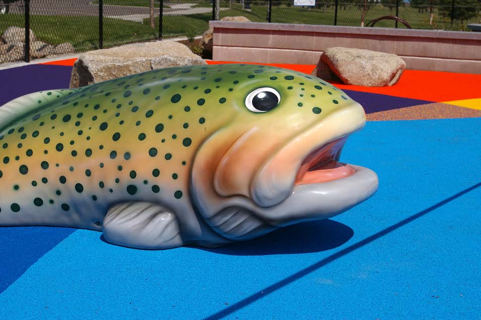 Huge brook trout made of concrete in a Spokane playground.